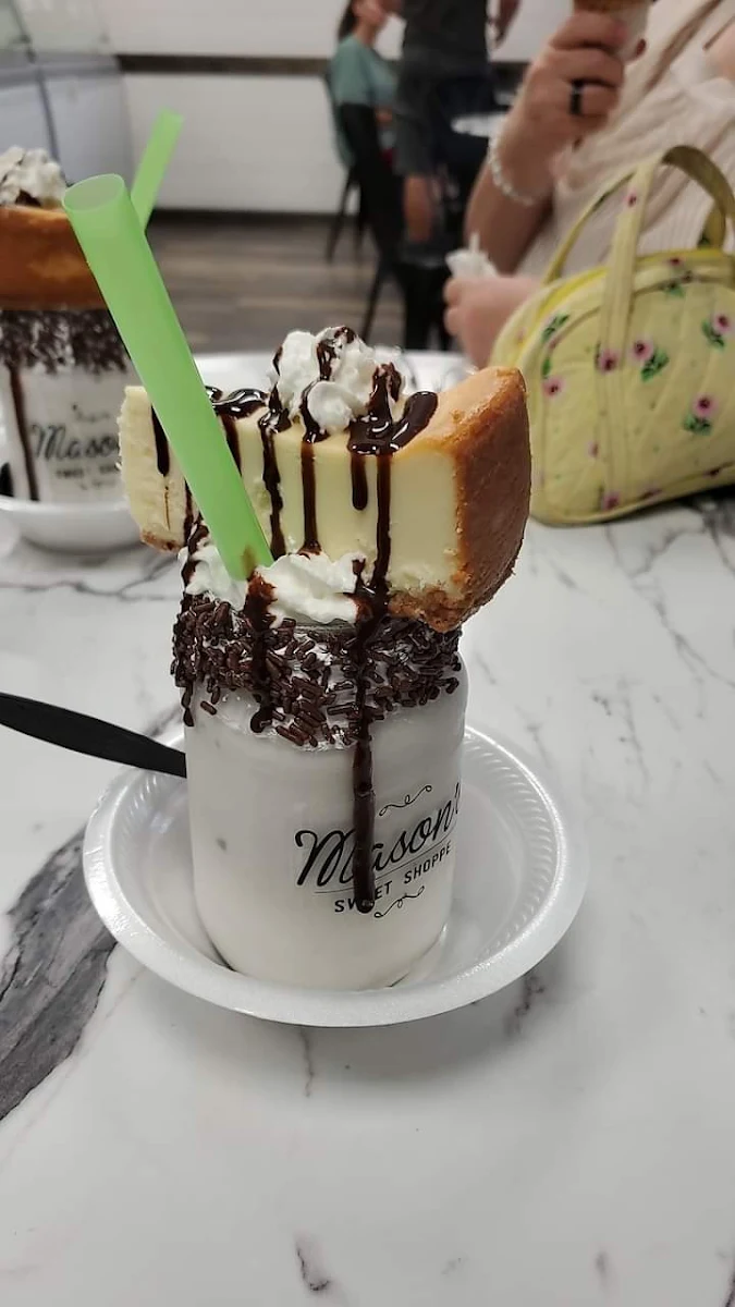 Razzle Dazzle Raspberry Cheesecake Milkshake with a Whopping Slice of Cheesecake on Top