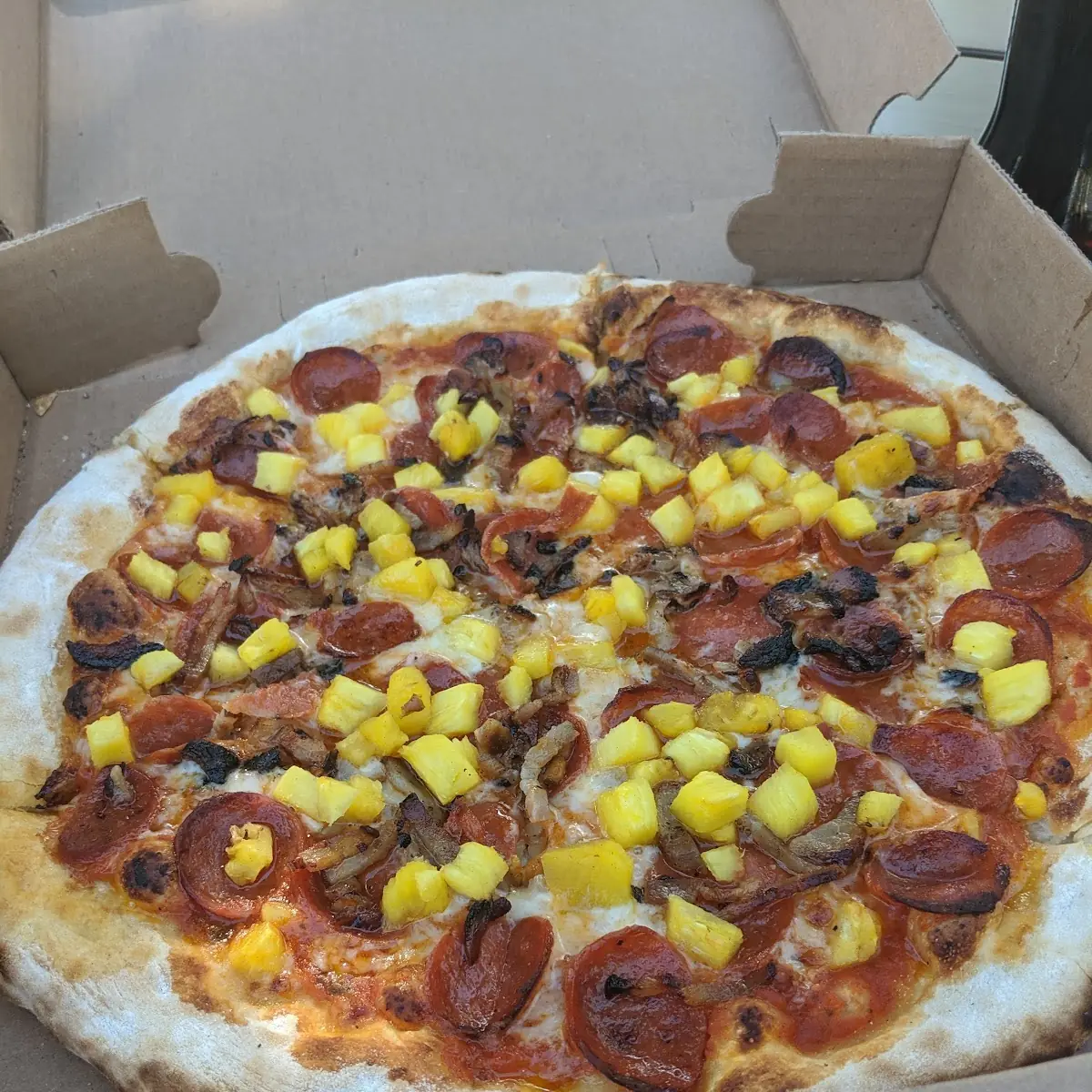 Wood Fire Pizza with Pepperoni Pineapple and Bacon