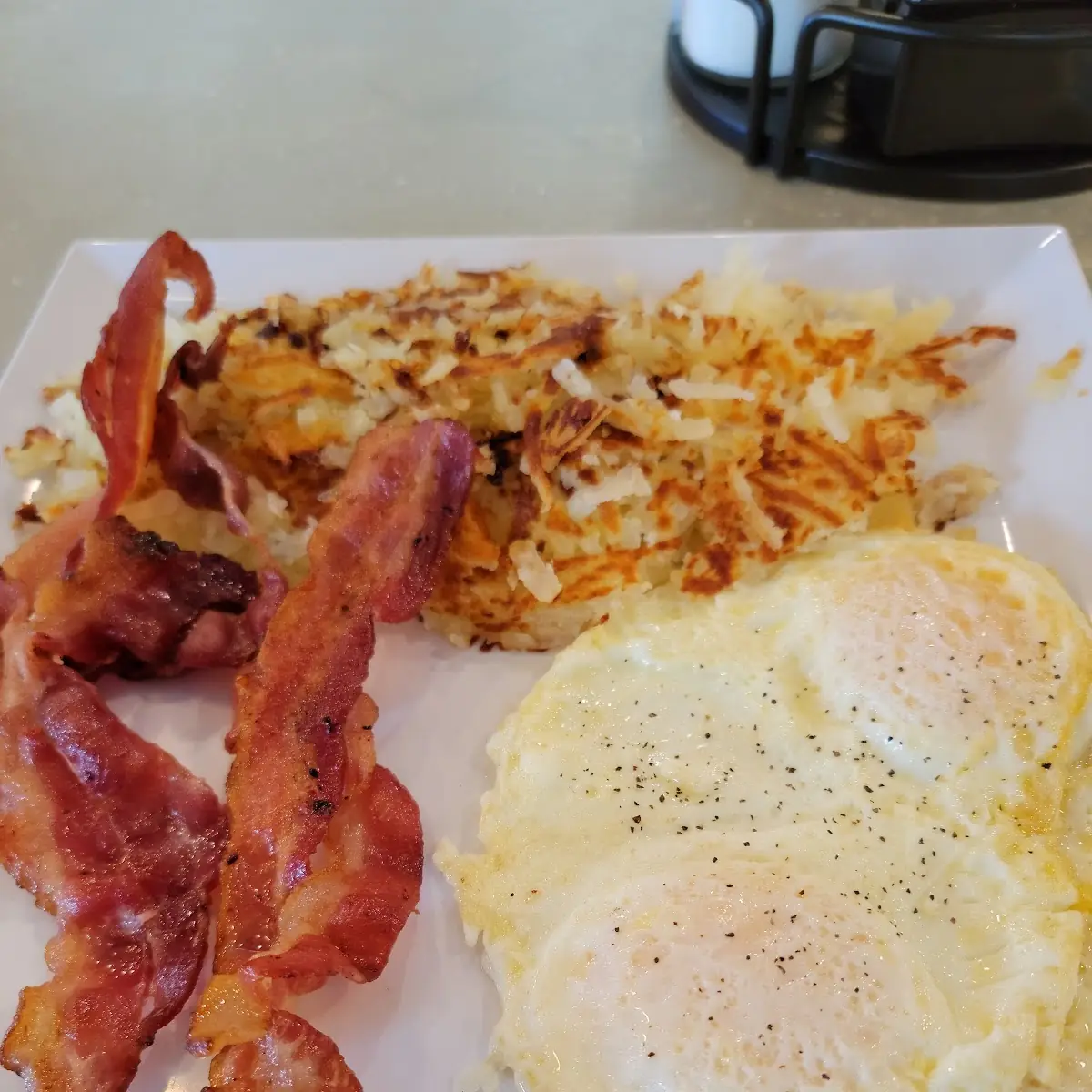 Eggs Bacon Hash Browns and Rye Toast