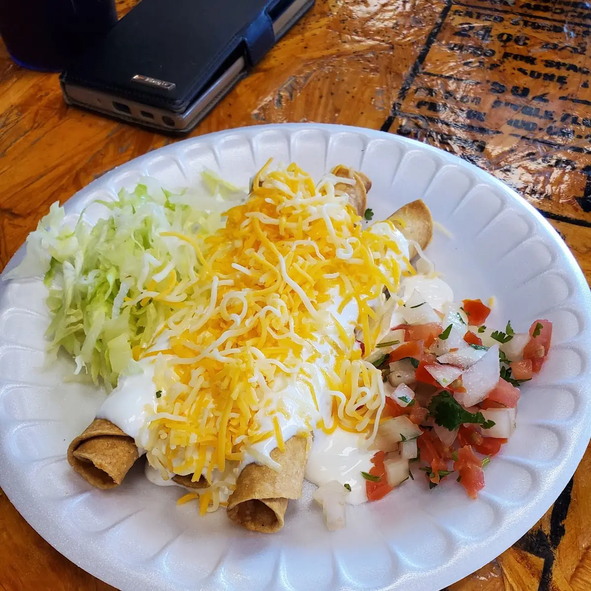 Three Rolled Taquitos with Sour Cream
