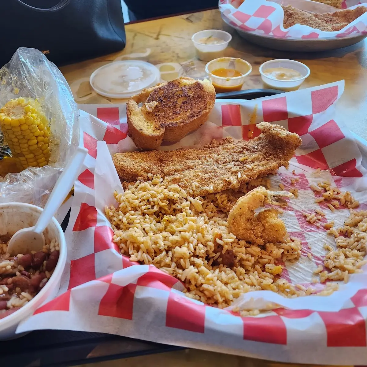 Fried Catfish Dinner with Cajun Rice Corn and Red Beans