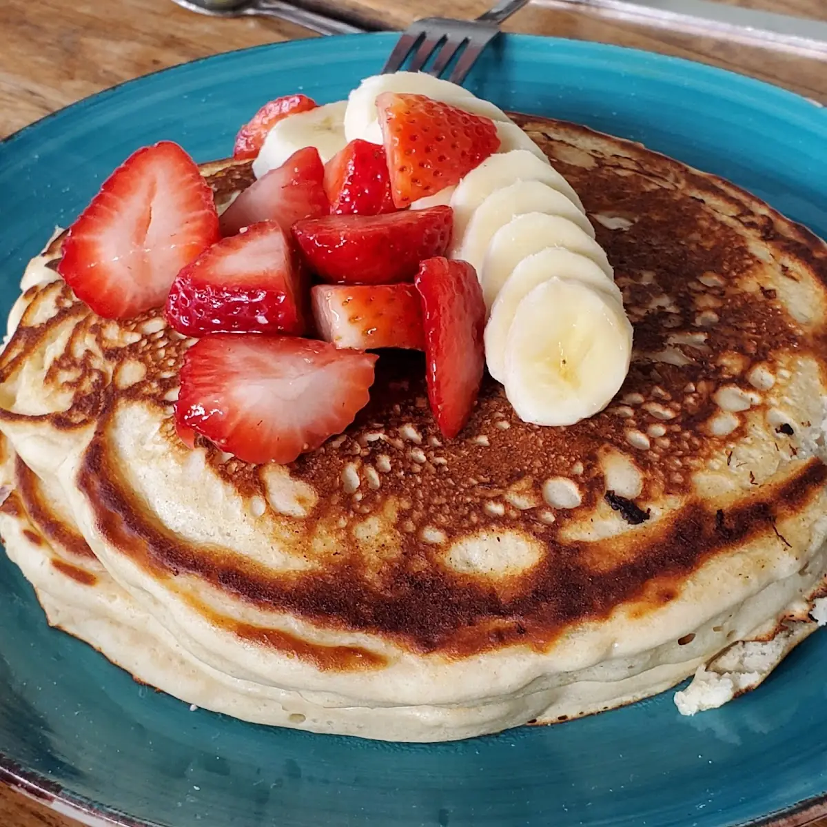 Stacked Pancakes with Fruit and Bacon