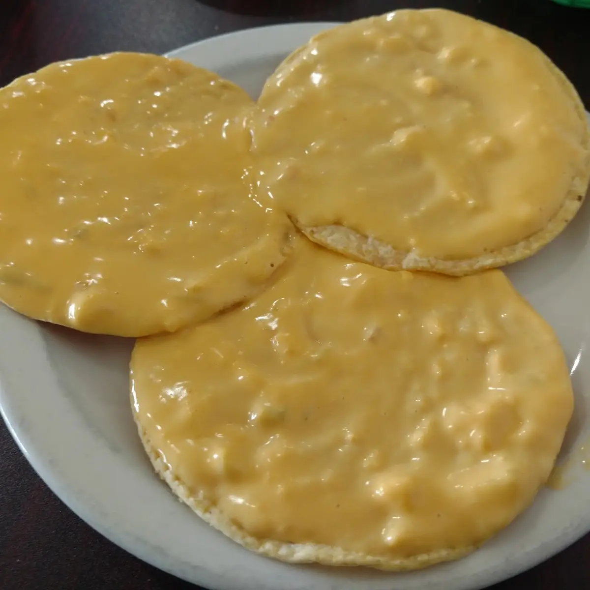 Chili Con Queso Tostada Chips with Queso on Top