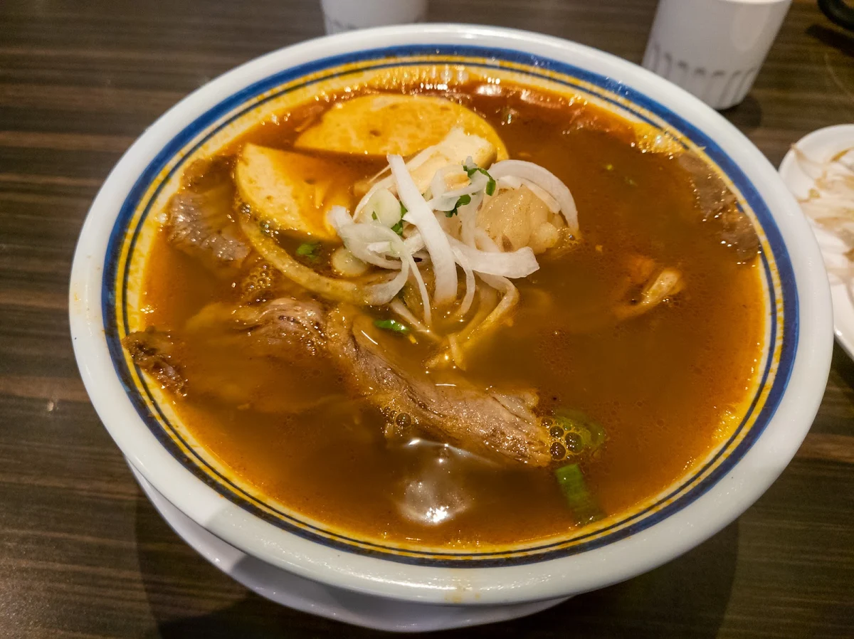 C08 - Spicy Hue Style Noodle Soup with Beef Shank Deep Fried Pork Sausage & Pork Palm