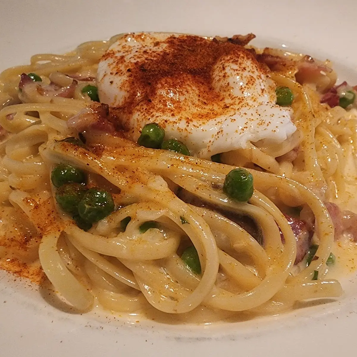 Spaghetti Carbonara Egg Crown Guanciale Parmigiano Fresh Pepper Green Peas