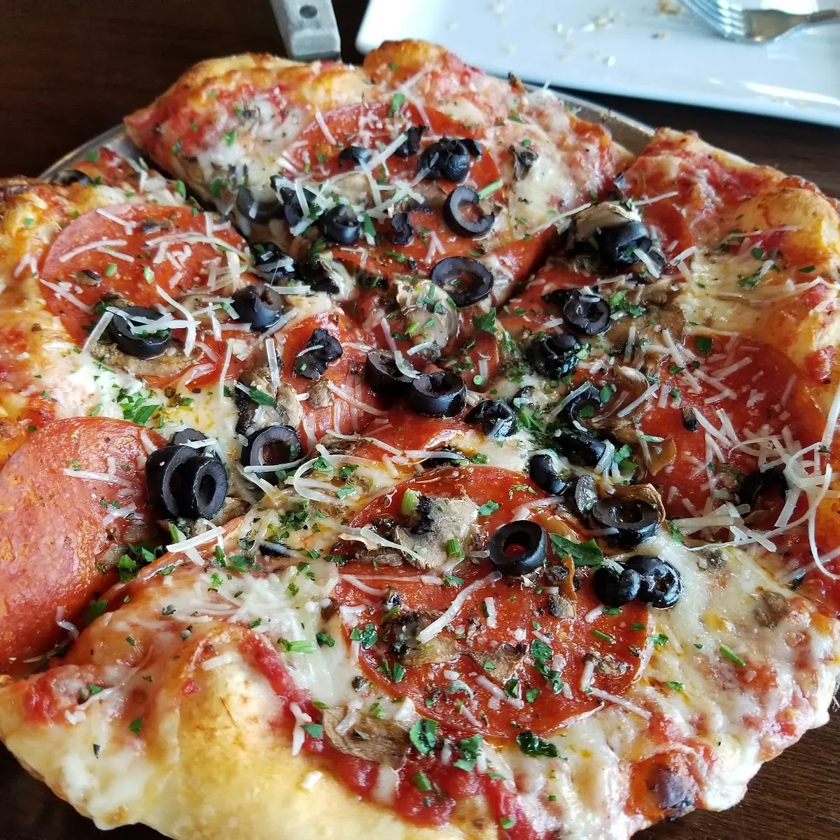 Pepperoni Olive and Mushroom Pizza