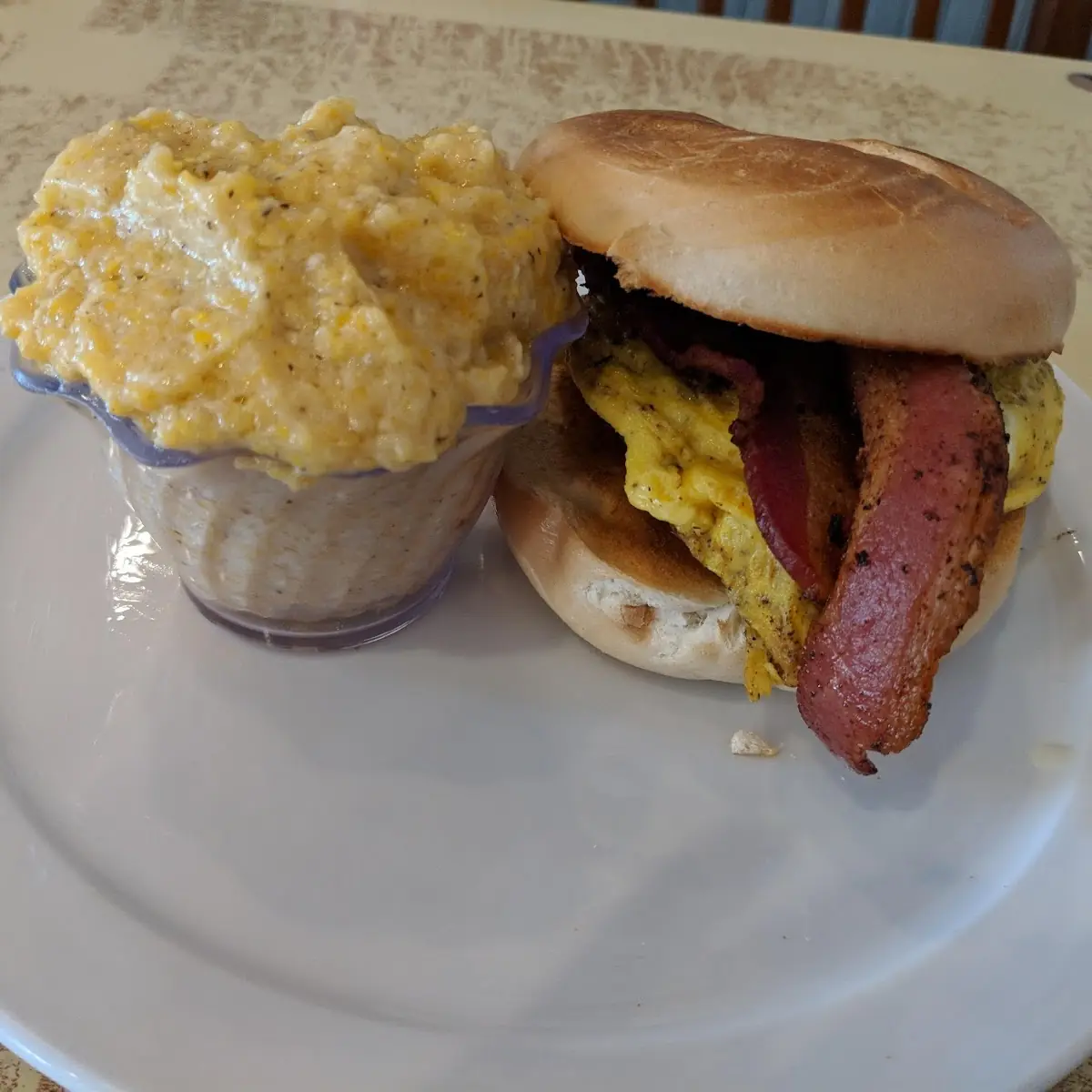 Franklin Breakfast Sandwich with Bacon on a Plain Bagel Side of Parmesan Cheese Grits