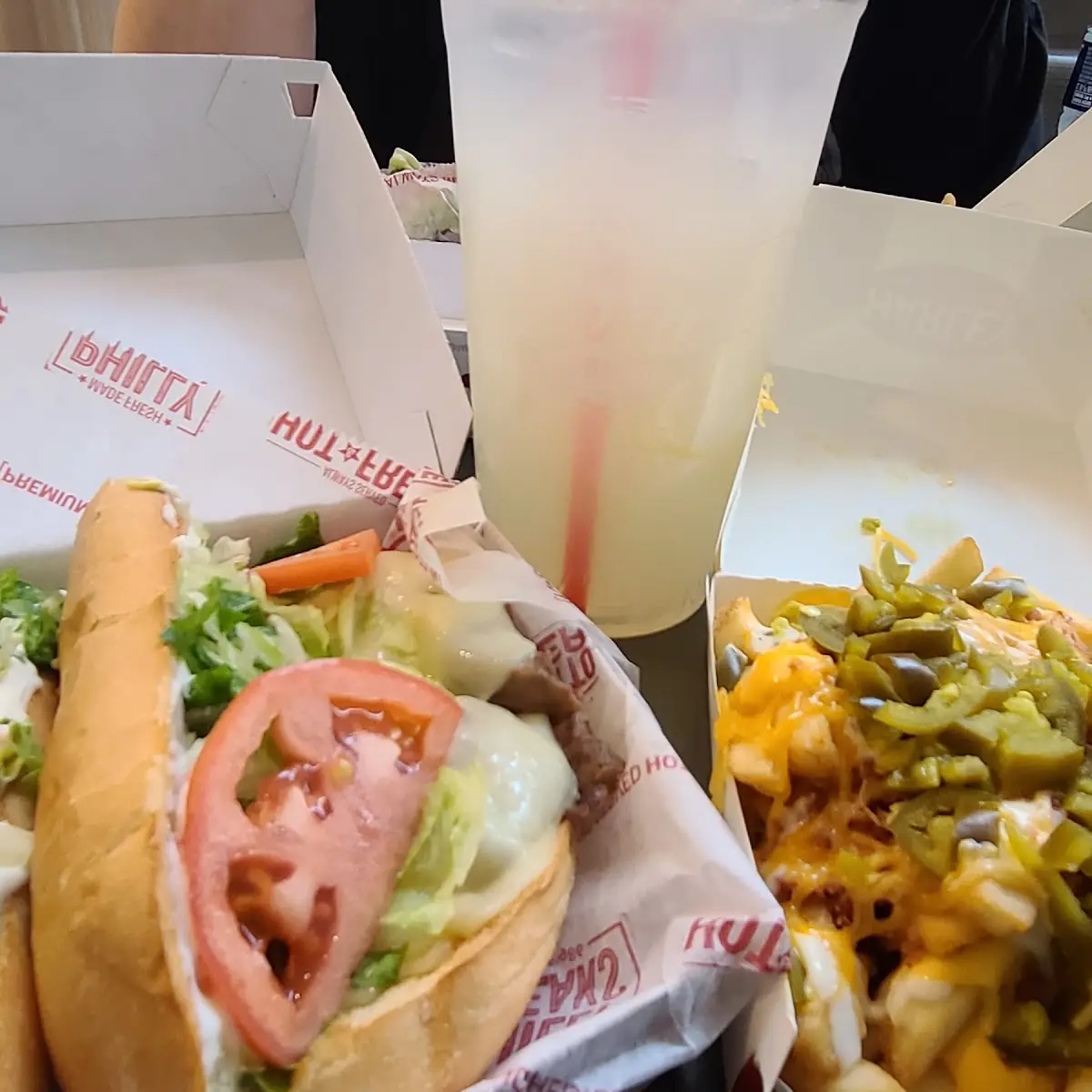 Steak and Cheese with a Lemonade and Fries with Jalapeños and Ranch Sauce