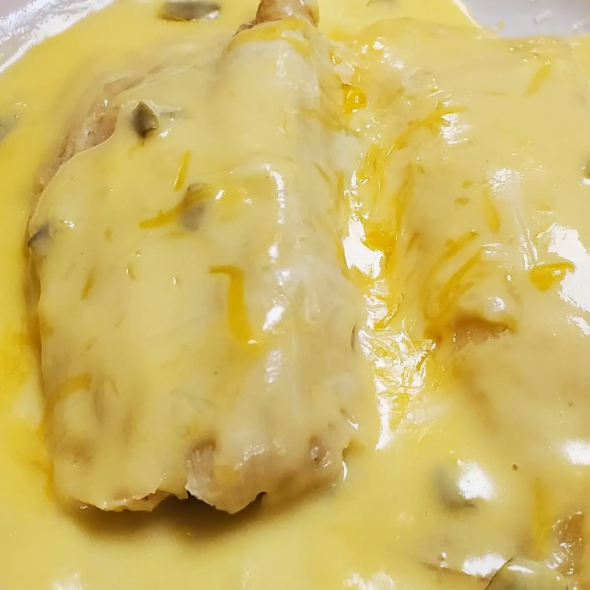 Beef Fajita Enchiladas with Queso on Top