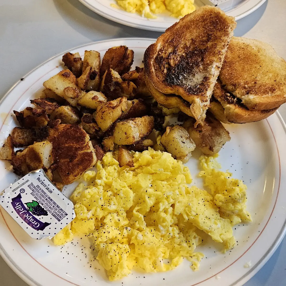 Scrambled Eggs Krispy Home Fries Toast and Coffee