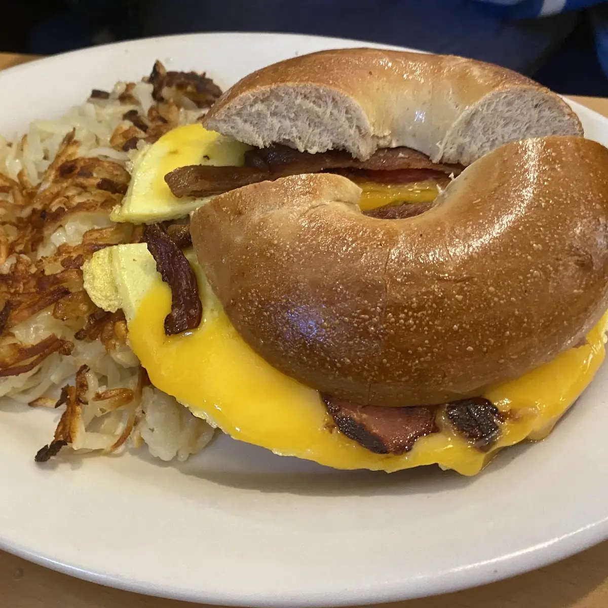 Egg and Bacon Bagel with Hash Browns
