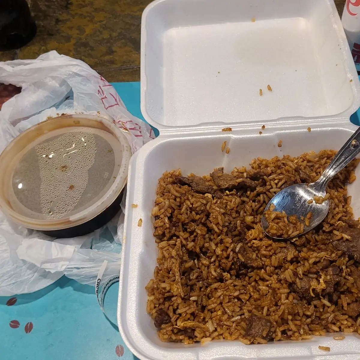 Beef Fried Rice Egg Only with the Rice Cooked Brown a Side of Brown Sauce