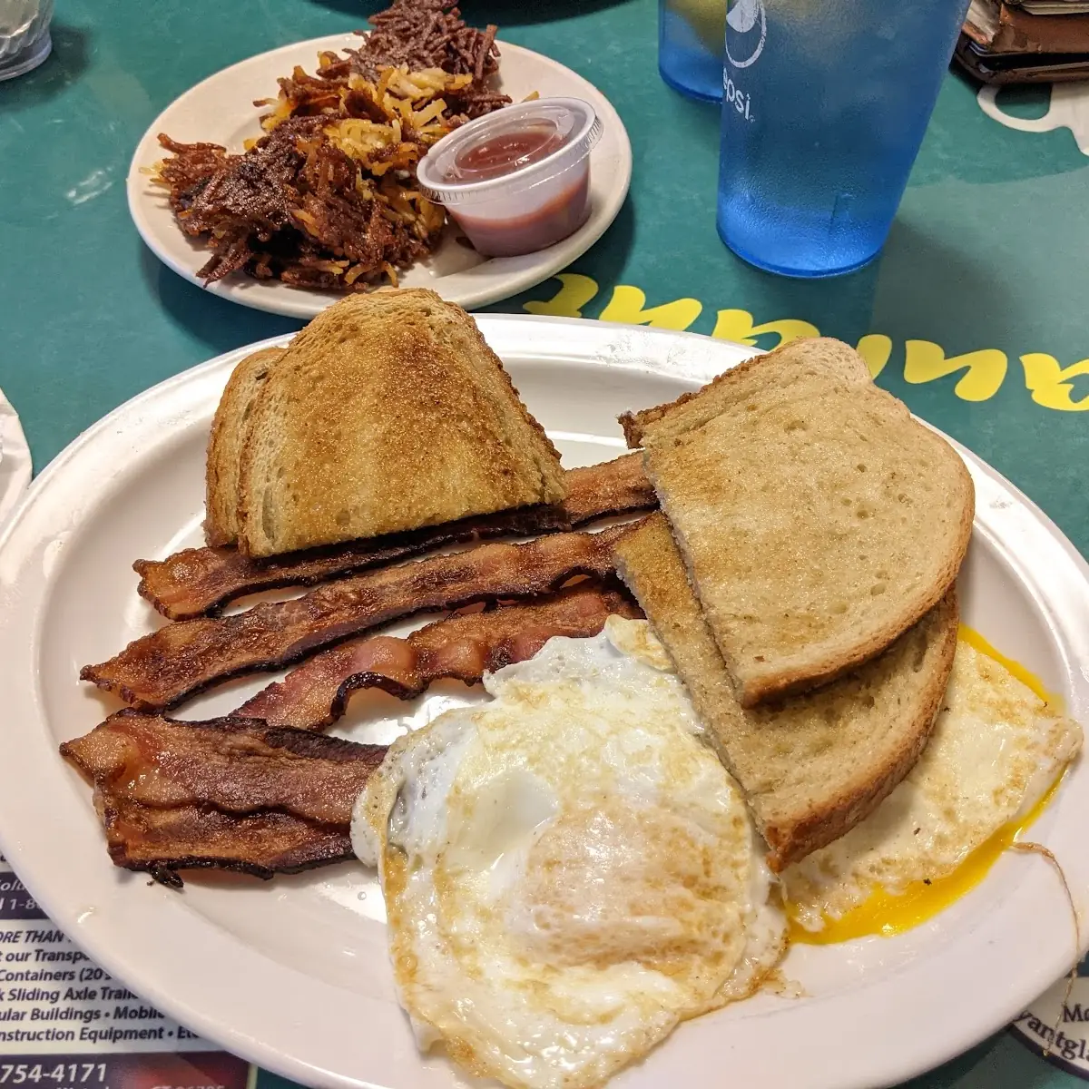 Eggs Bacon Rye Toast and Hashbrowns