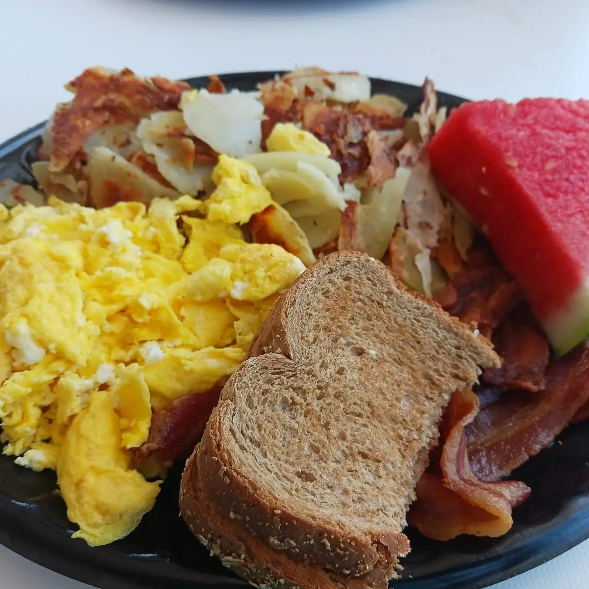 Hash Browns Scrambled Eggs Bacon and Toast