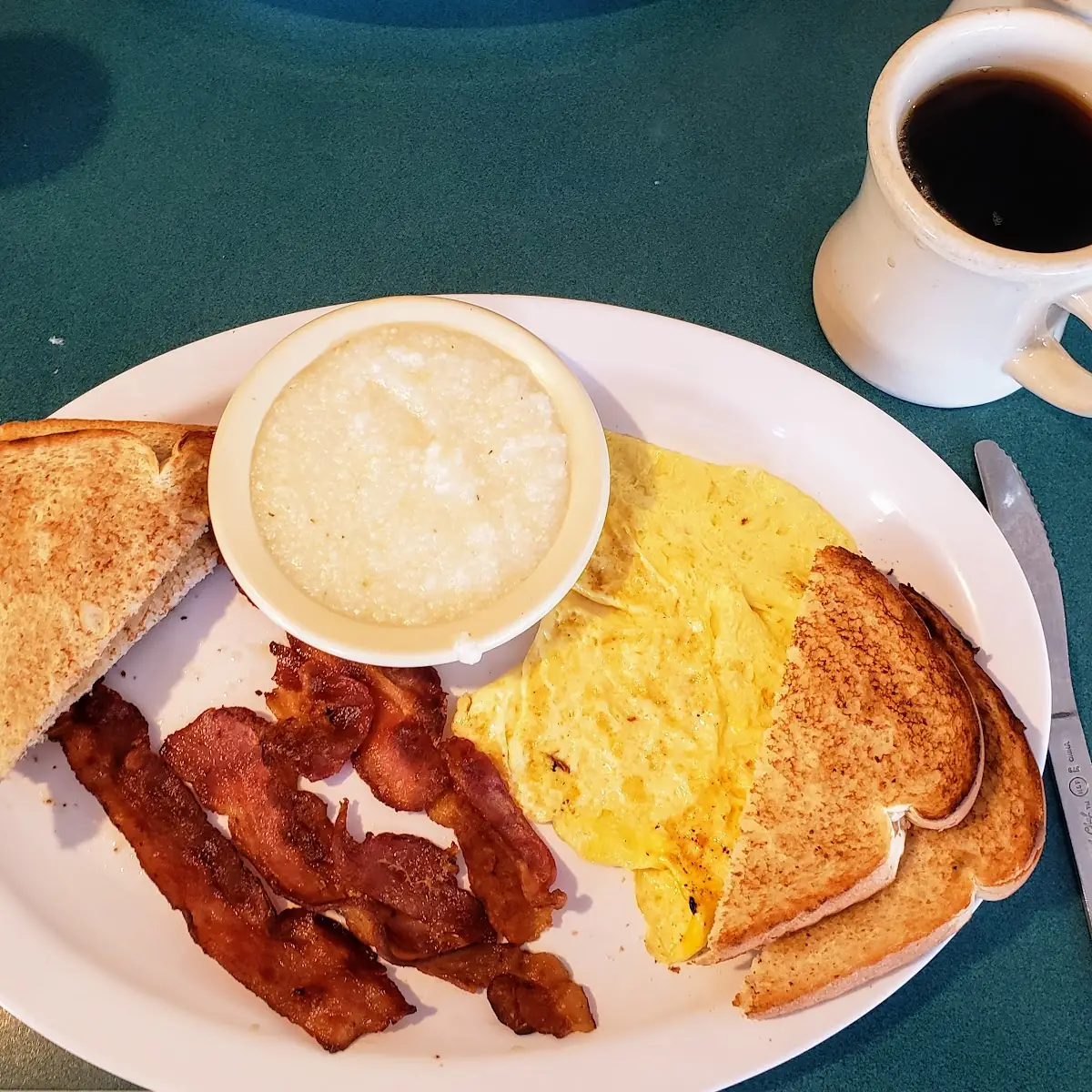 Scrambled Eggs Bacon Grits and Toast