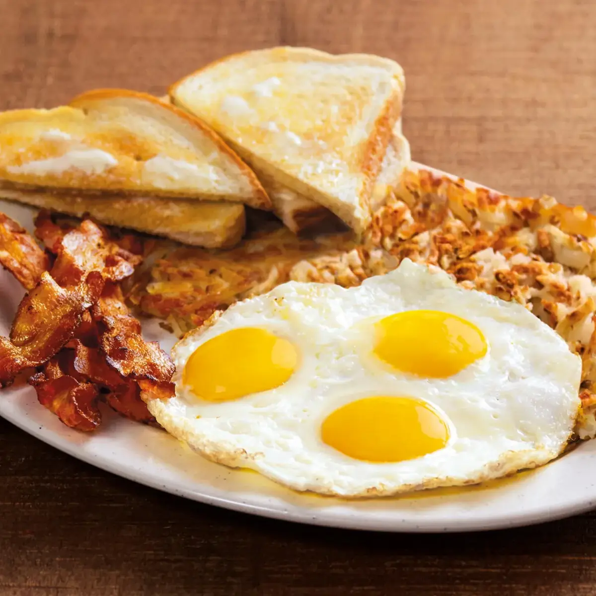 3 Egg Breakfast with Bacon and Hash Browns