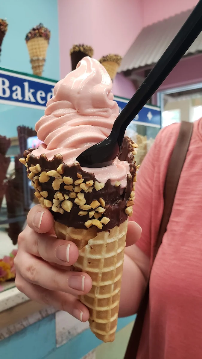 Strawberry Soft Serve Ice Cream in a Blonde Cone with Nuts
