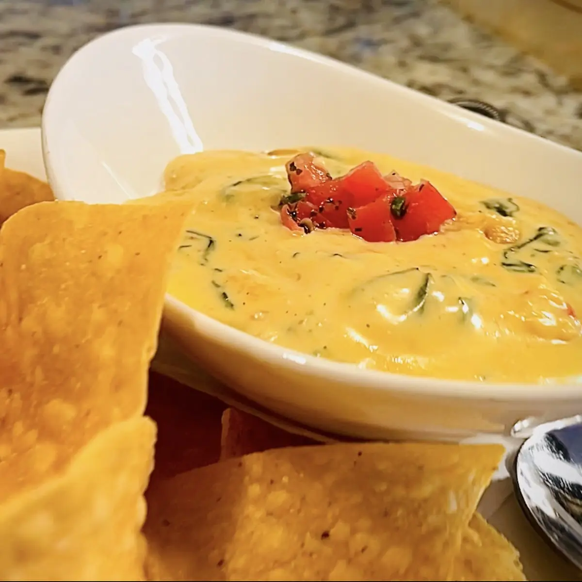 Lobster Spinach Queso with Pepper Jack Cheese Lobster and Spinach Served with Tortilla Chips