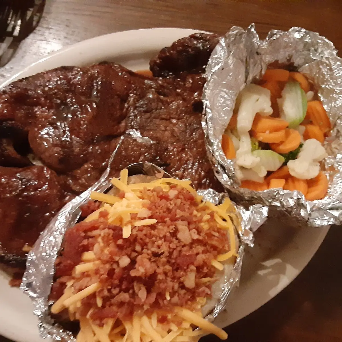 Sirloin Steak with Steamed Vegetables and Loaded Baked Potato