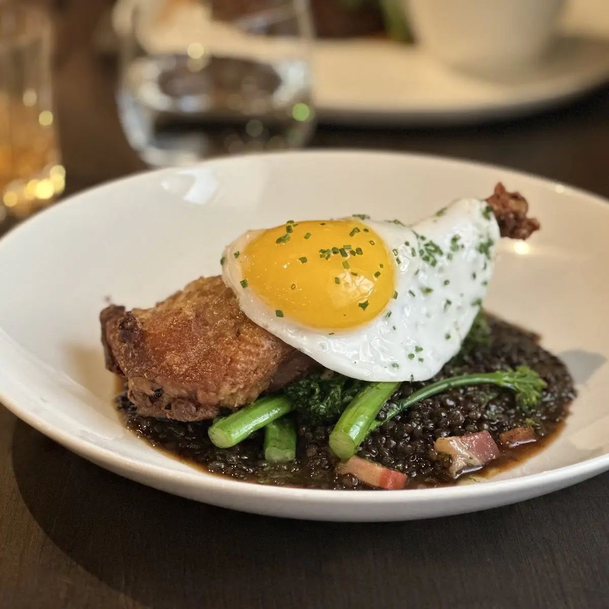Duck Confit Beluga Lentils & Bacon Fried Duck Egg Broccolini, Treadwell Cuisine