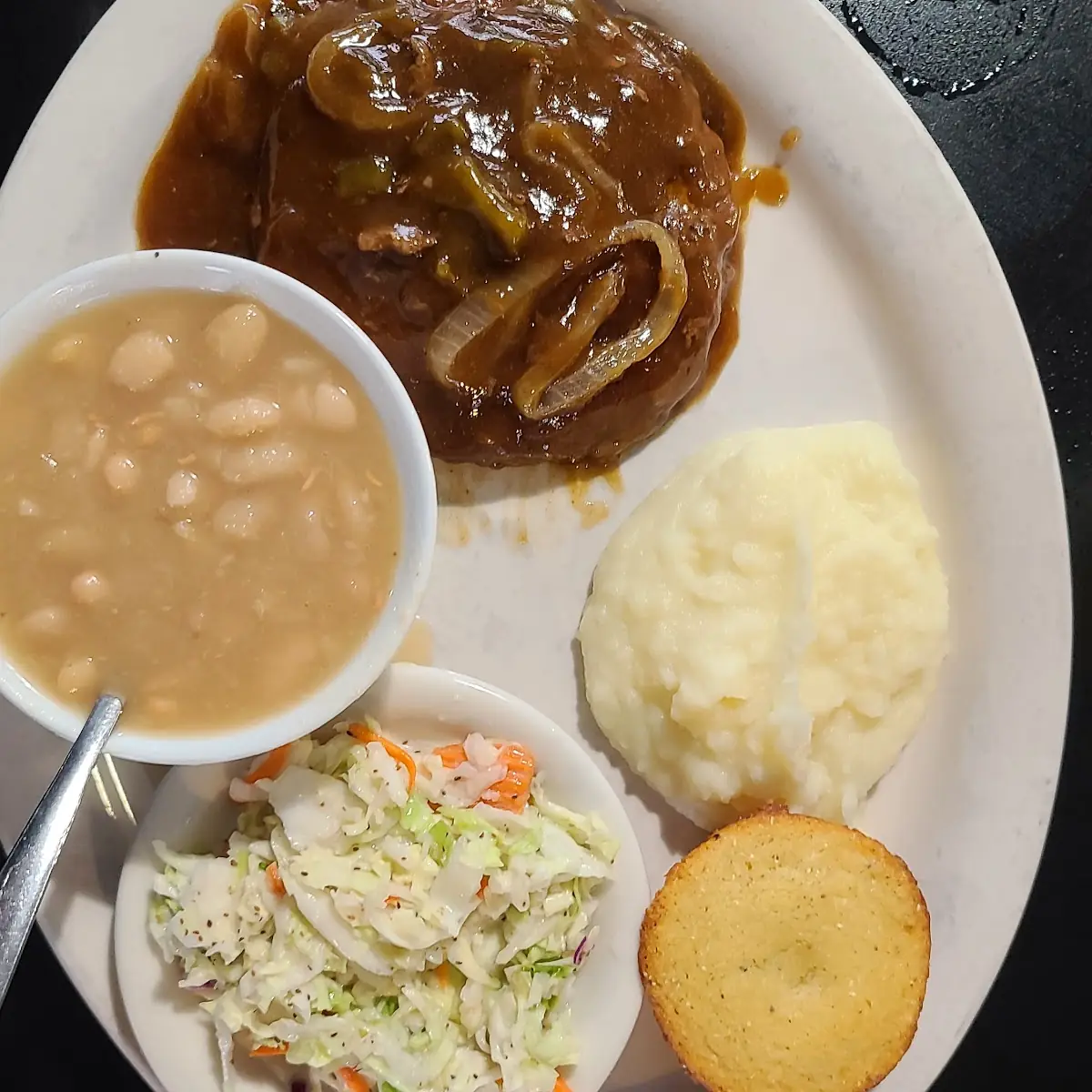 Hamburger Steak Mashed Potatoes White Beans Coleslaw and Cornbread