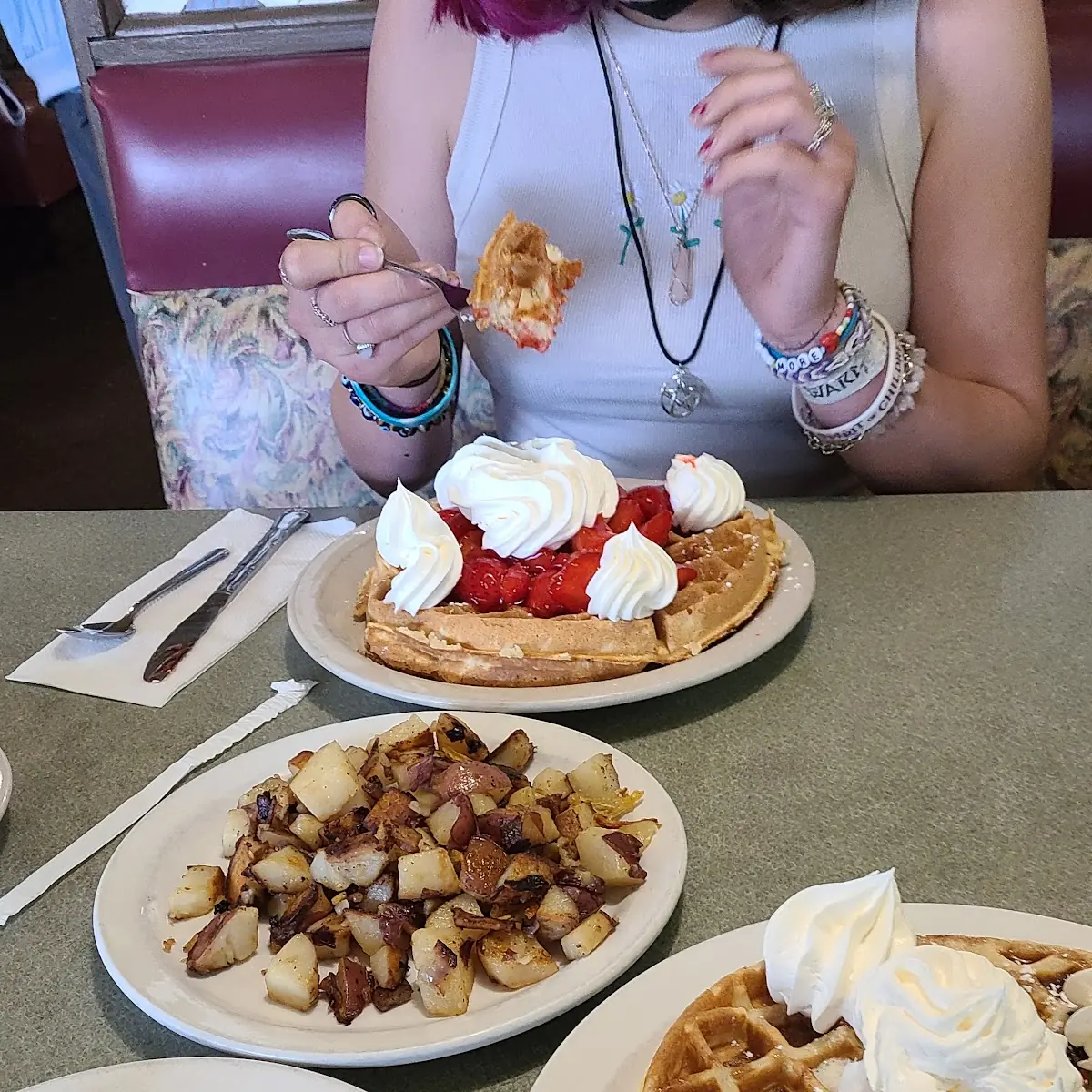 Strawberry Waffle Country Potatoes Scrambled Eggs Bacon Sausage and Pecan Waffle