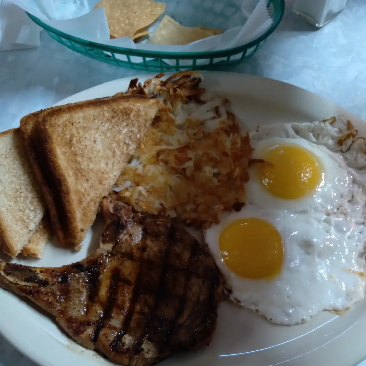 4 Pork Chop Eggs and Hash Browns