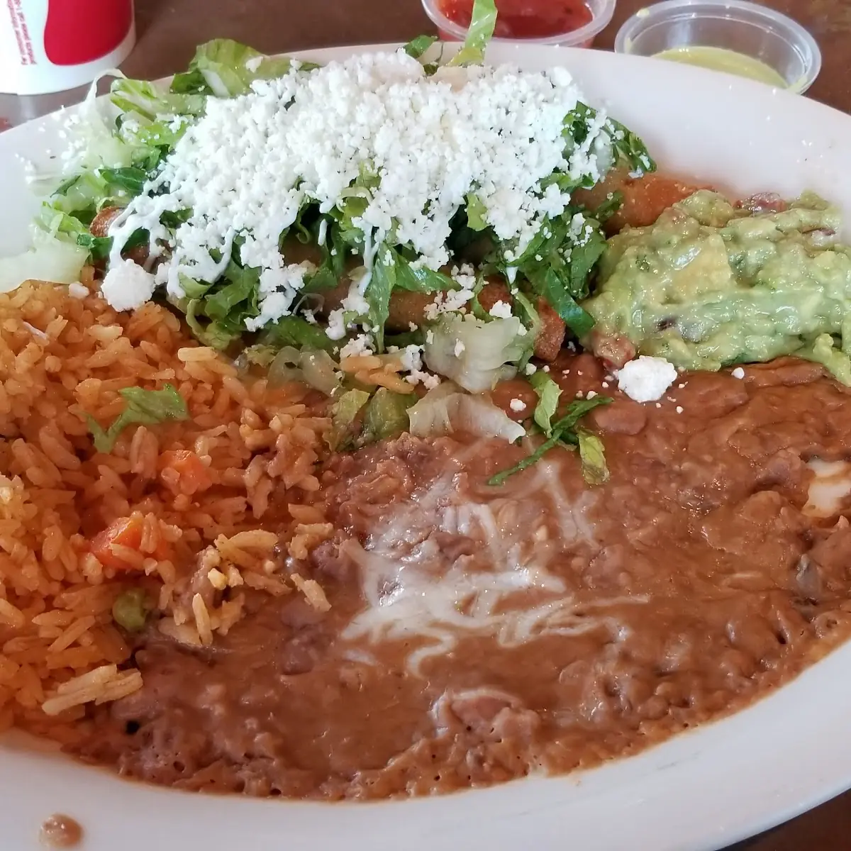 3 Rolled Tacos with Side of Rice and Beans