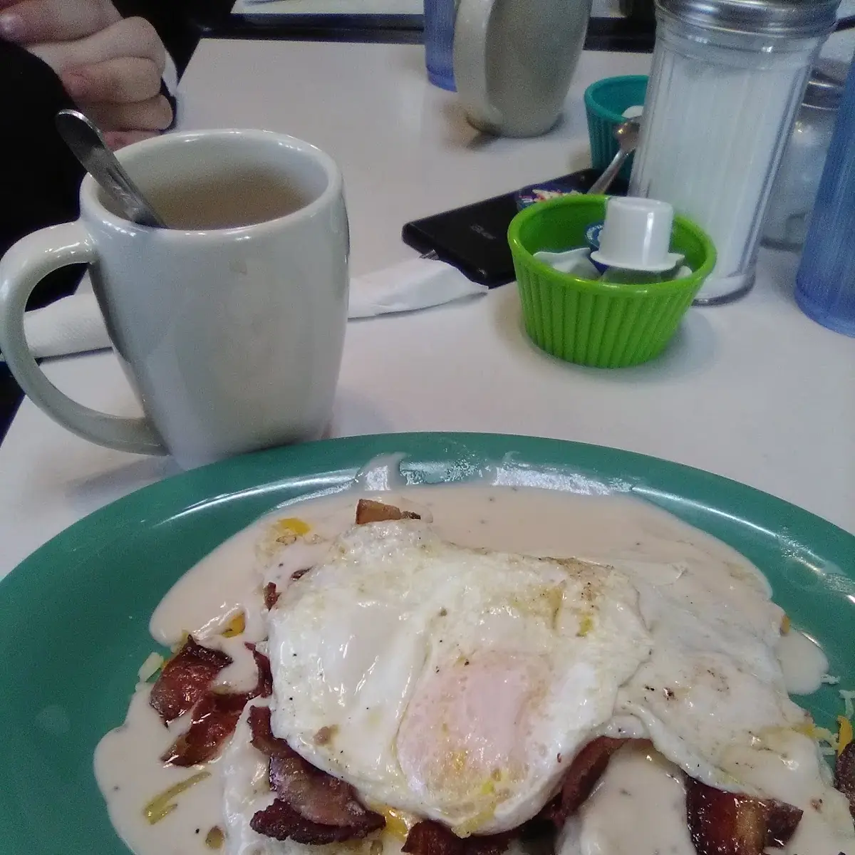 Biscuits and Gravy with Eggs over Medium