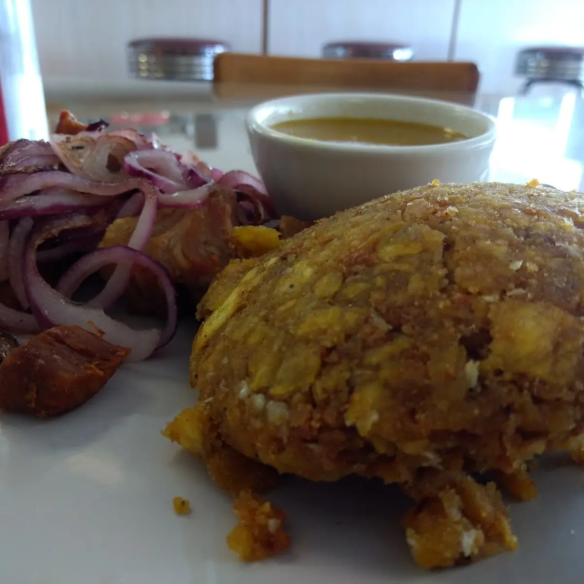 Mofongo with Pork Chunks and Sauteed Onions