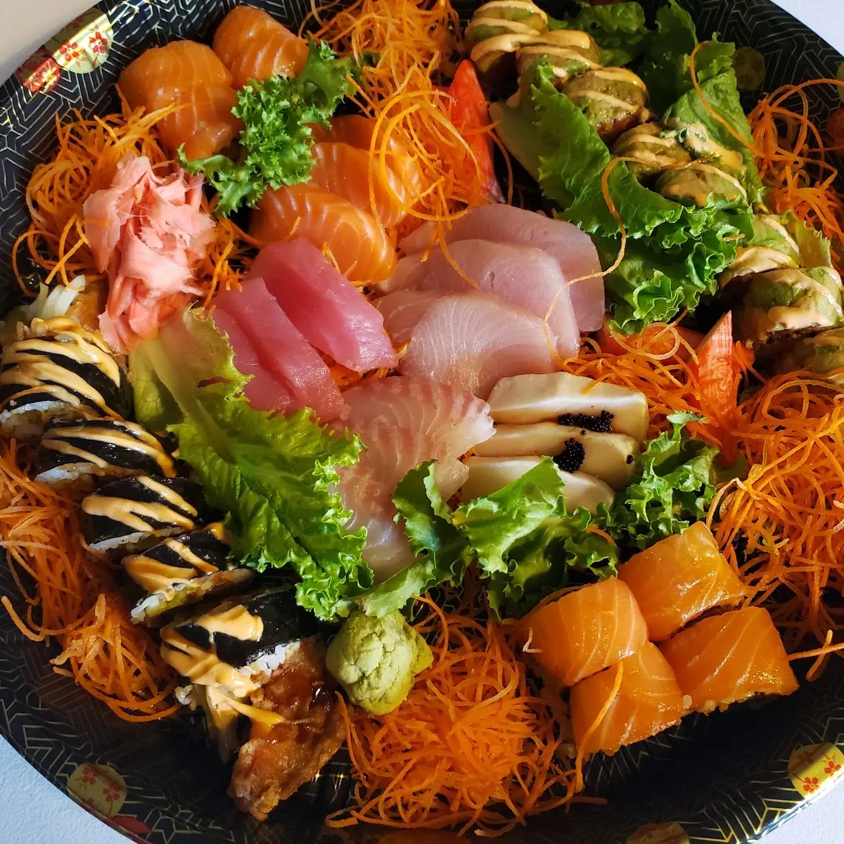 Sashimi Deluxe and 3 Sushi Rolls