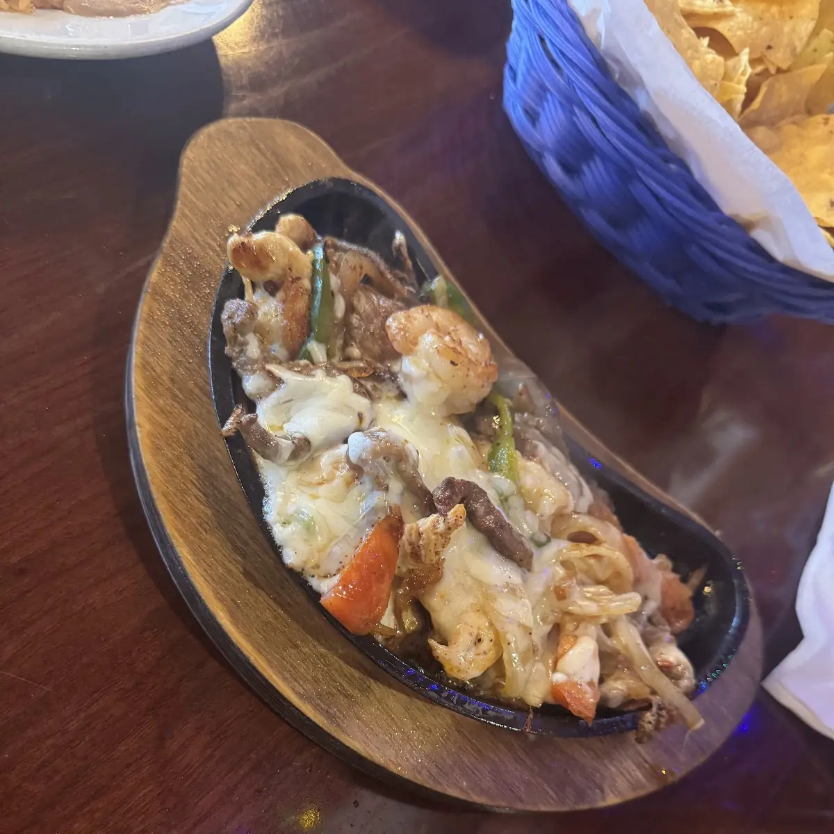 Fiesta Chicken Shrimp and Steak Fajitas