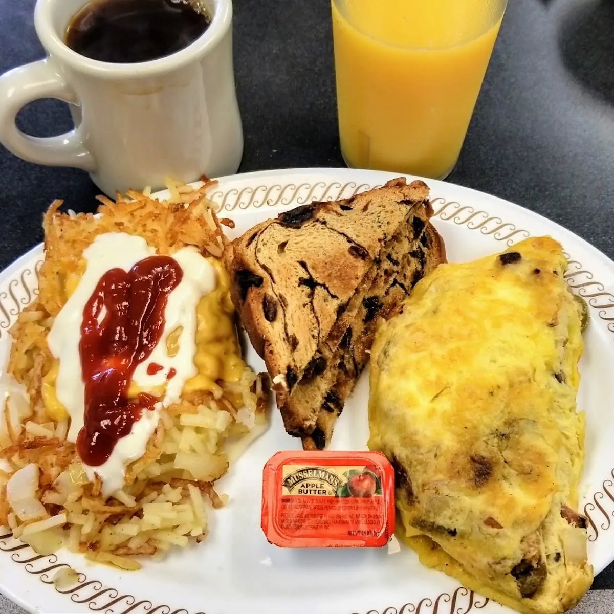 Fiesta Omelette with Hash Browns and Raisin Toast