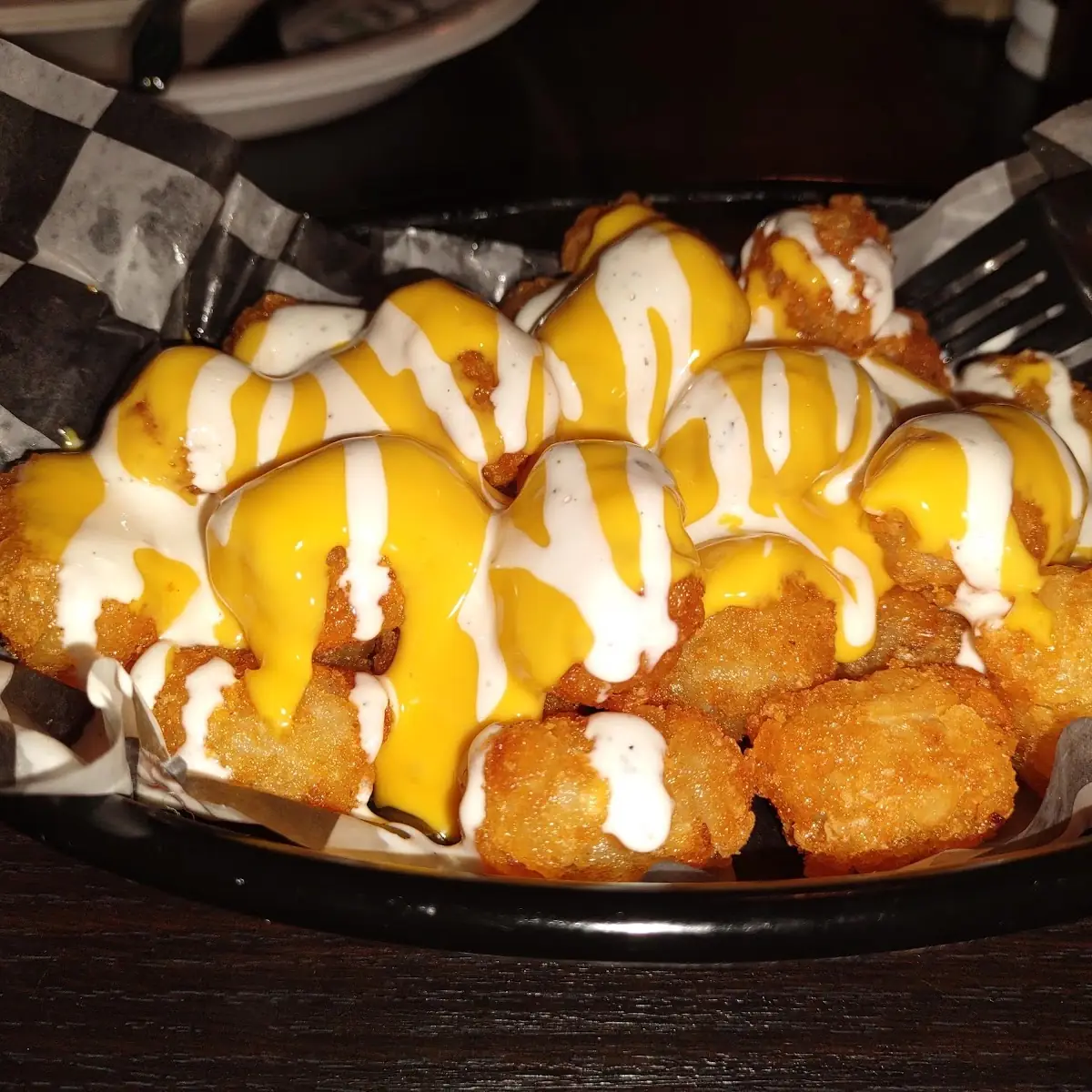 Tater Tots with Cheese and Ranch Dressing