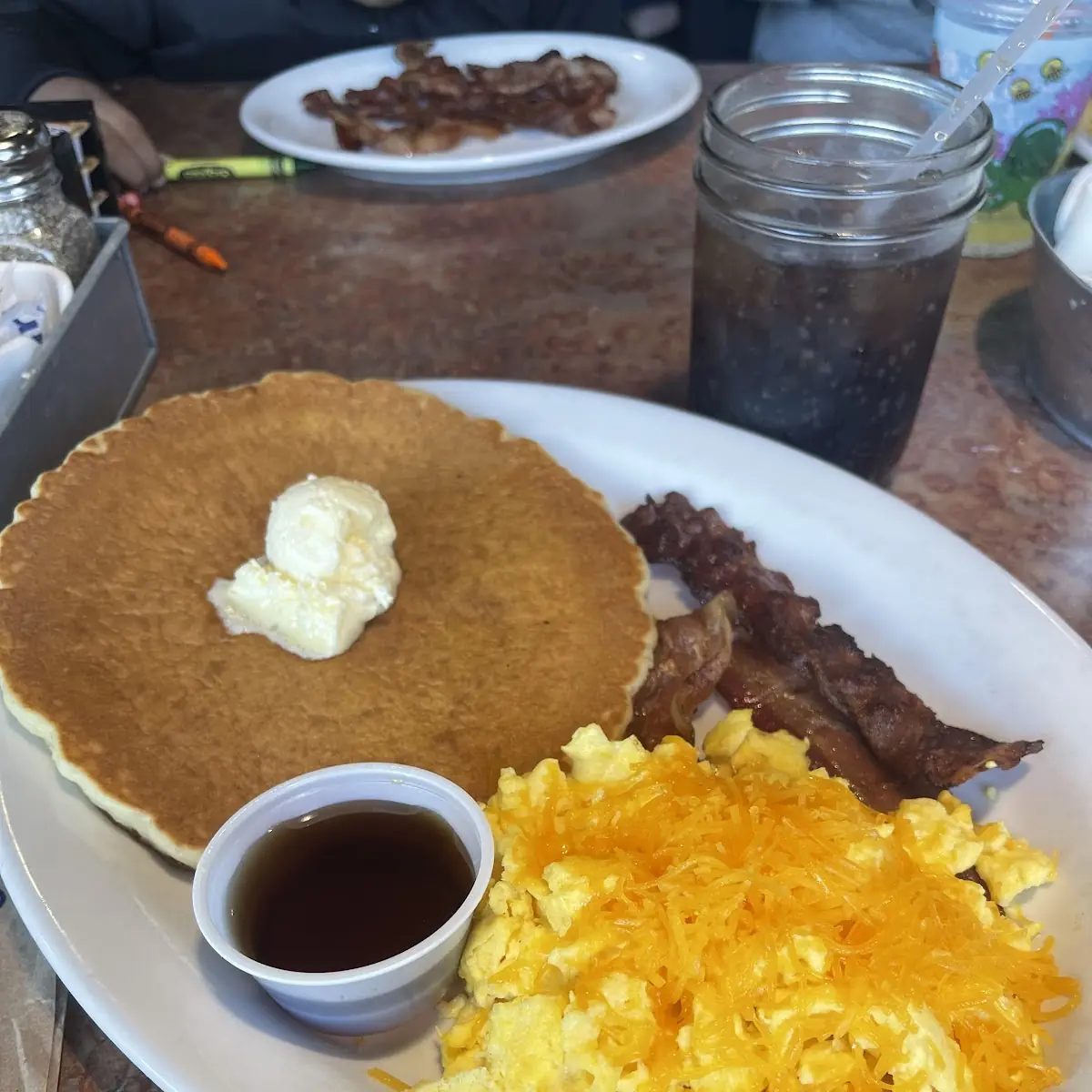 Pancakes and Scrambled Eggs with Cheese and Bacon