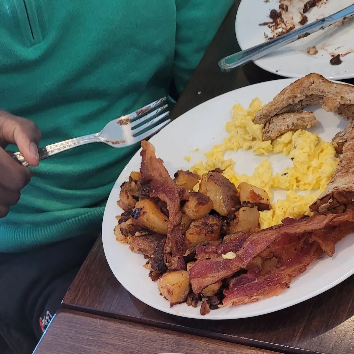 Eggs and Corned Beef Hash Home Potatoes Bacon
