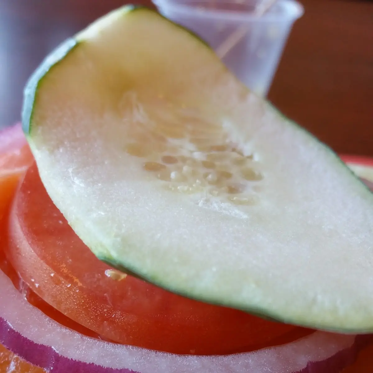 Everything Bagel with Salmon Onion Tomato and Cucumber