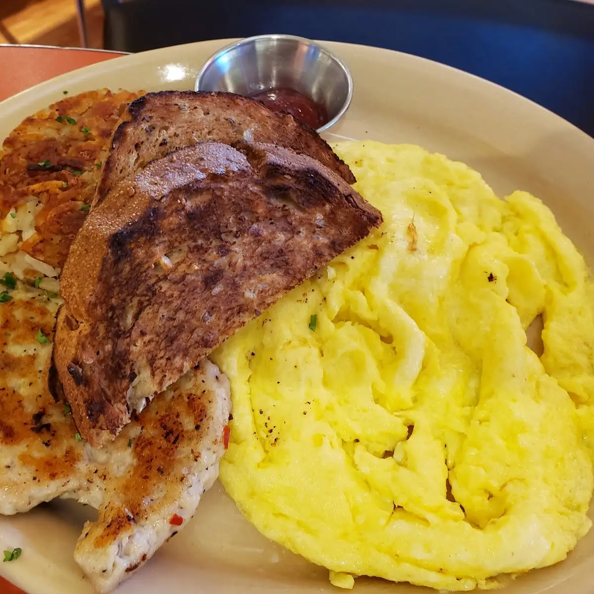 Traditional Breakfast Scrambled Eggs with Spinach and Cheese Bacon Hashbrowns and Wheat Toast