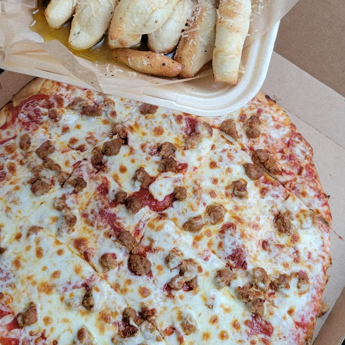 Large Thin Crust Pizza with Italian Sausage and Pepperoni