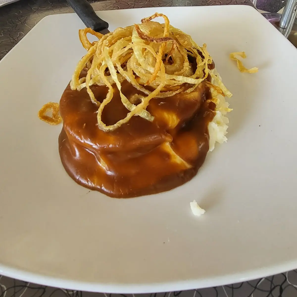 Bacon Wrapped Meatloaf over Mashed Potatoes
