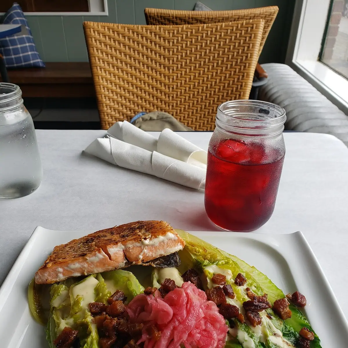 Seared Salmon over Pan Seared Romaine Heritage Bacon Pickled Onion Mustard-Shallot Dressing