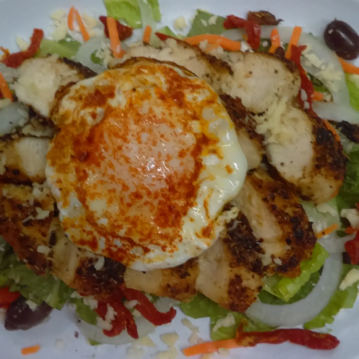 Fried Egg on a Grilled Chicken Salad