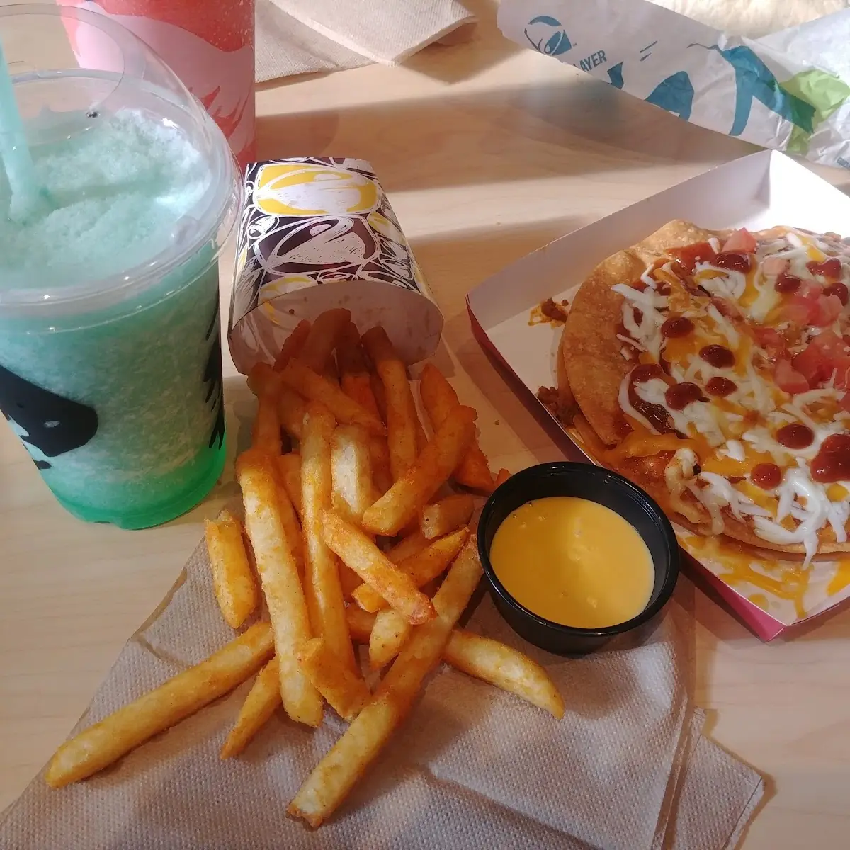Mountain Dew Baja Blast Twisted Freeze with Tequila Nacho Fries and a Mexican Pizza