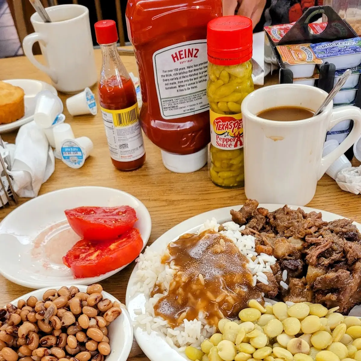 Beef Stew Lima Beans Rice and Gravy Sliced Tomatoes an Black Eyed Peas