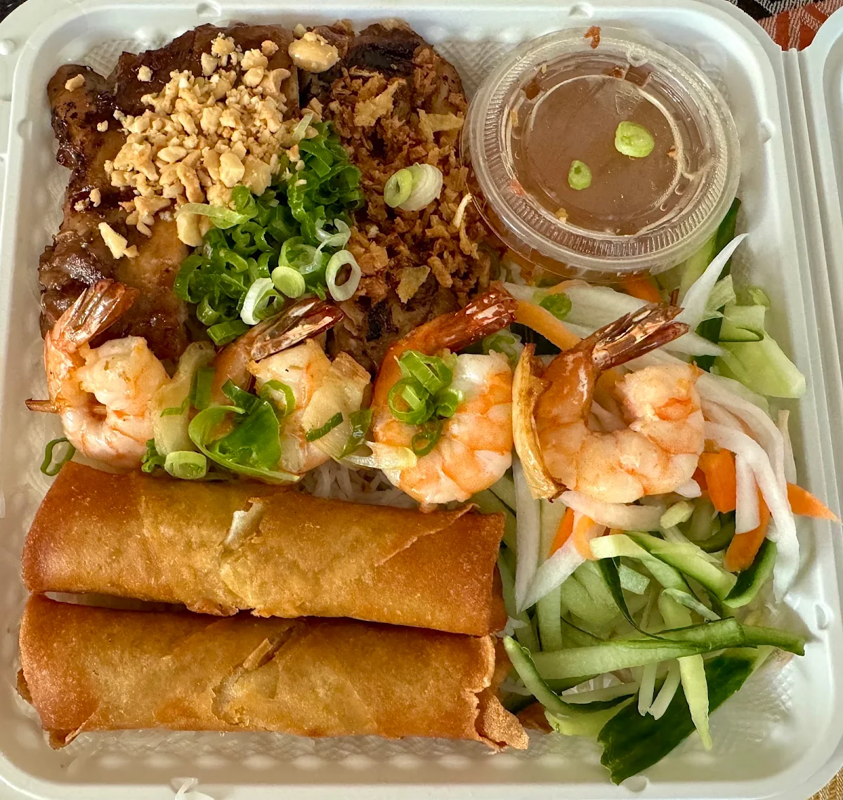 Grilled Chicken with Spring Rolls and Prawn Skewer