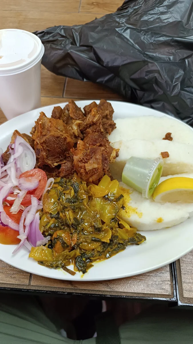 Goat Meat Spinach Salad and Ugali Corn Flour Made