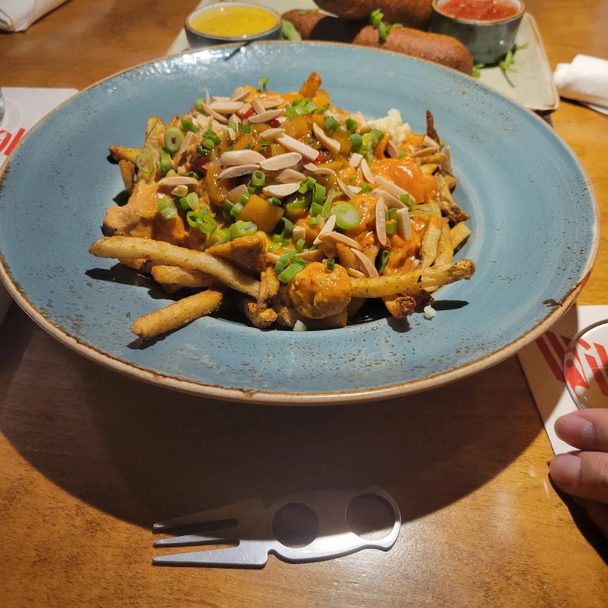 Butter Chicken Poutine, C’est What? Inc.
