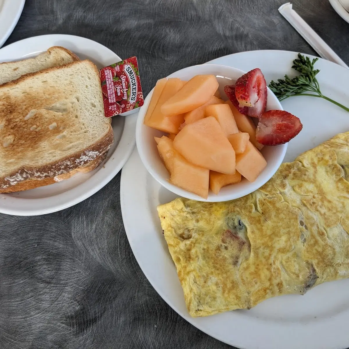 Meat Lovers Omelette with Toast and Fruit