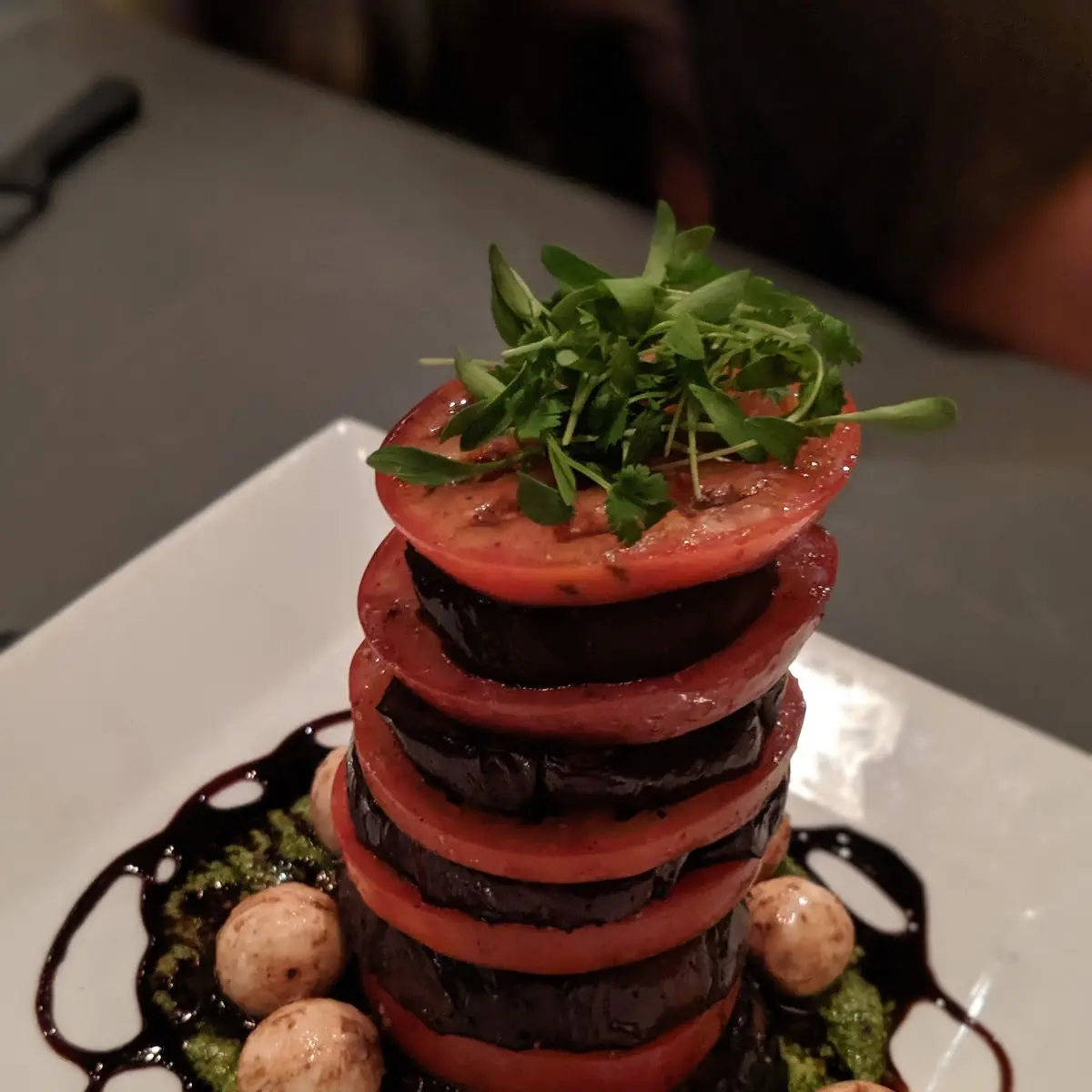 Grilled Eggplant and Vine Ripe Tomato Pave with Mozzarella Balls and Basil Pesto & Balsamic Glaze