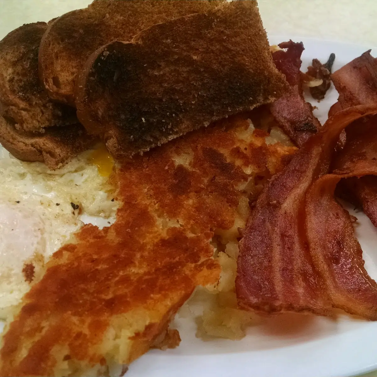 Eggs Bacon Hash Browns and Toast